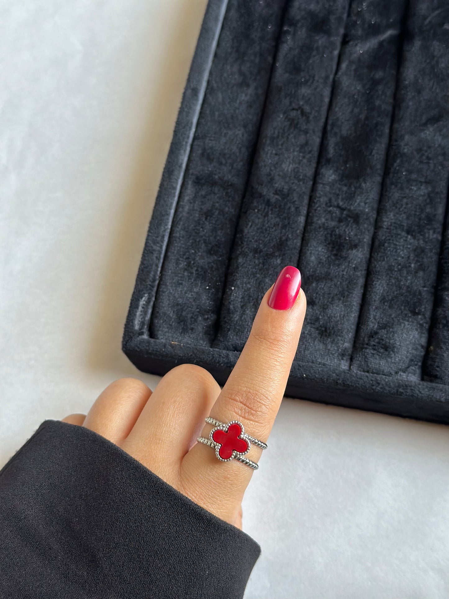 Silver colored vancleef ring