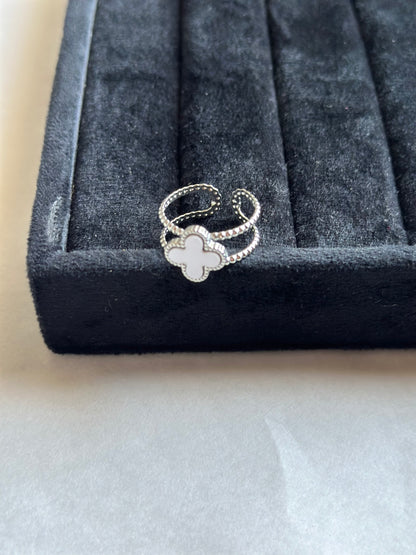 Silver colored vancleef ring