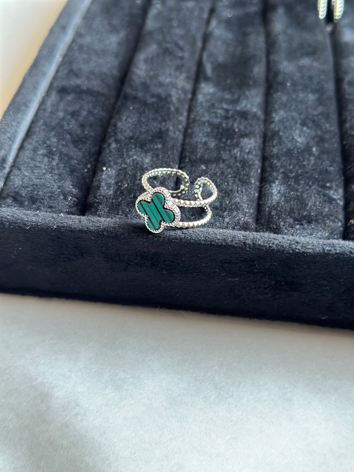 Silver colored vancleef ring