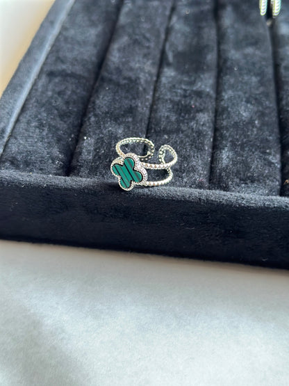 Silver colored vancleef ring