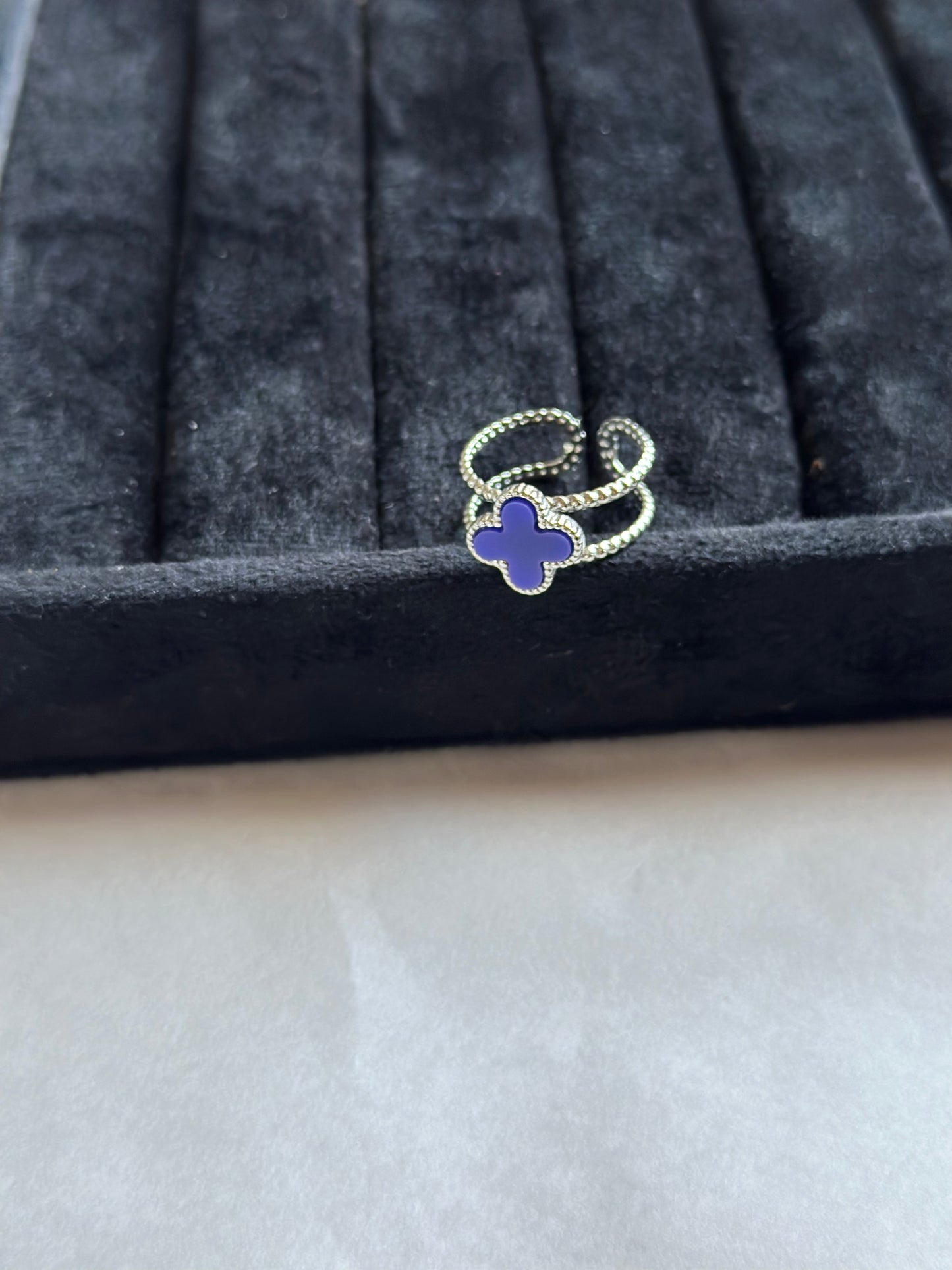 Silver colored vancleef ring