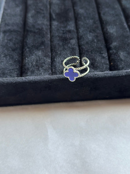 Silver colored vancleef ring