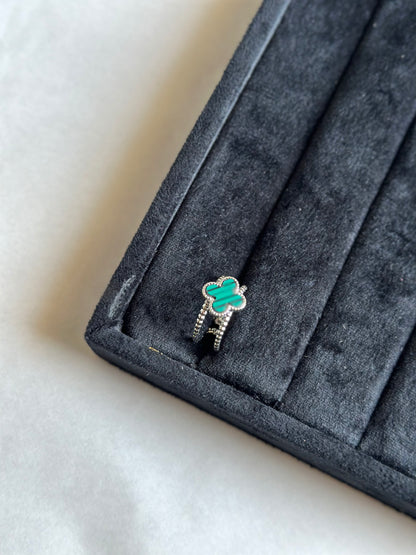 Silver colored vancleef ring