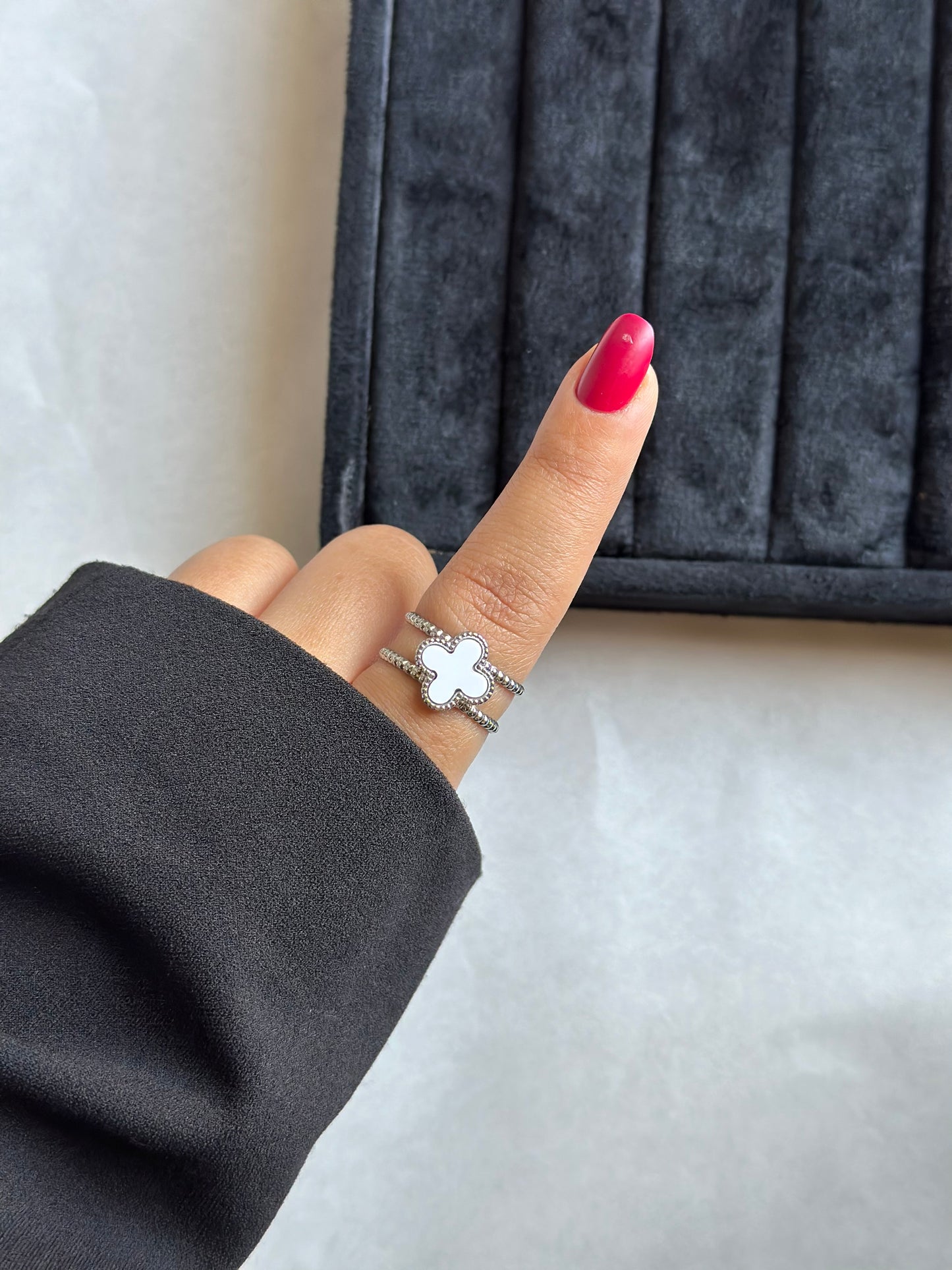 Silver colored vancleef ring