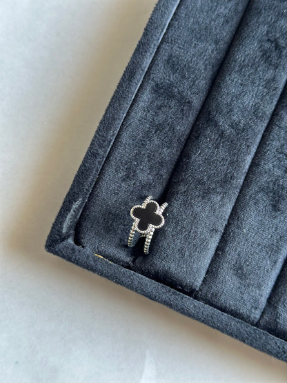 Silver colored vancleef ring
