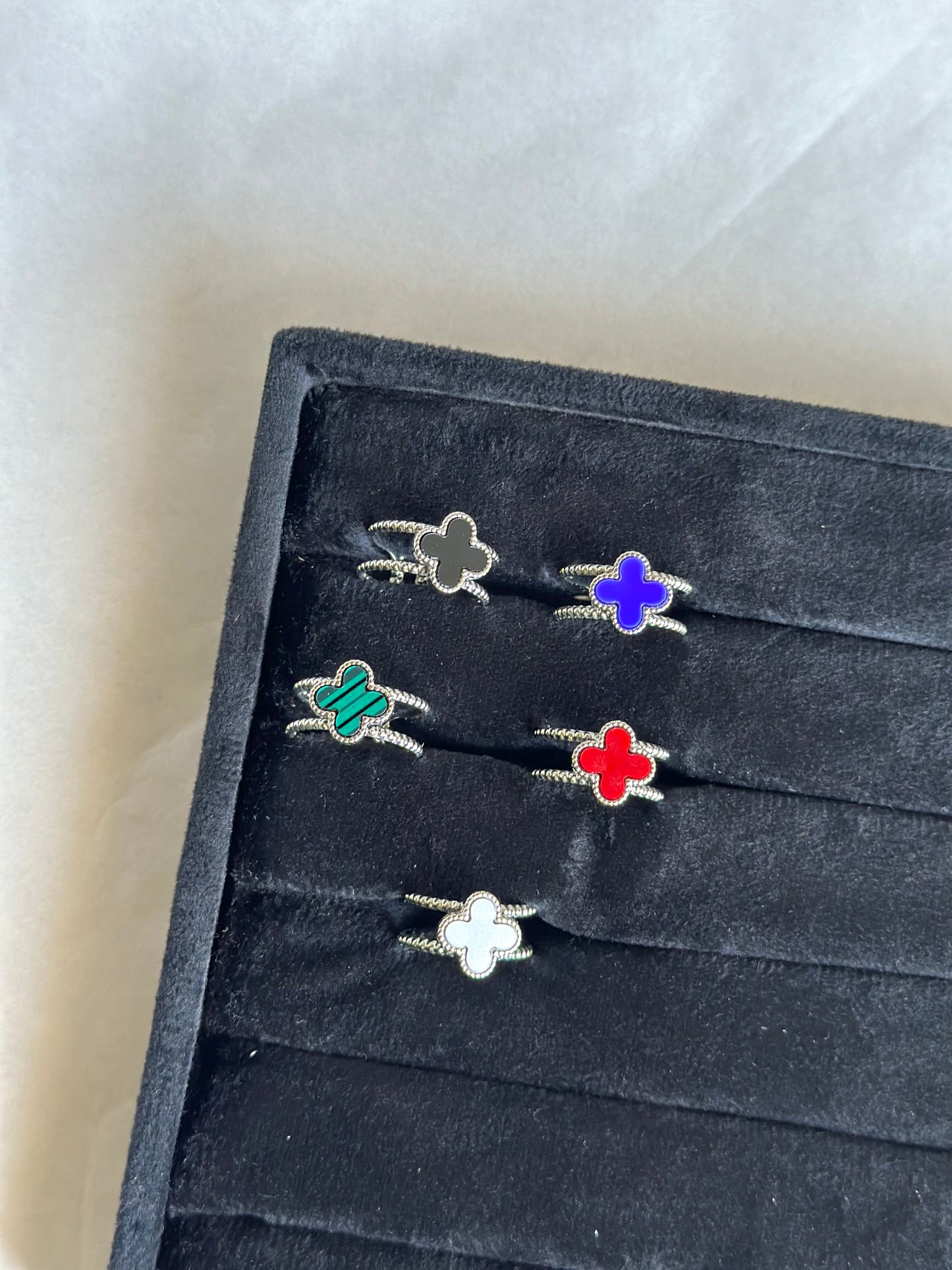 Silver colored vancleef ring