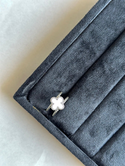 Silver colored vancleef ring