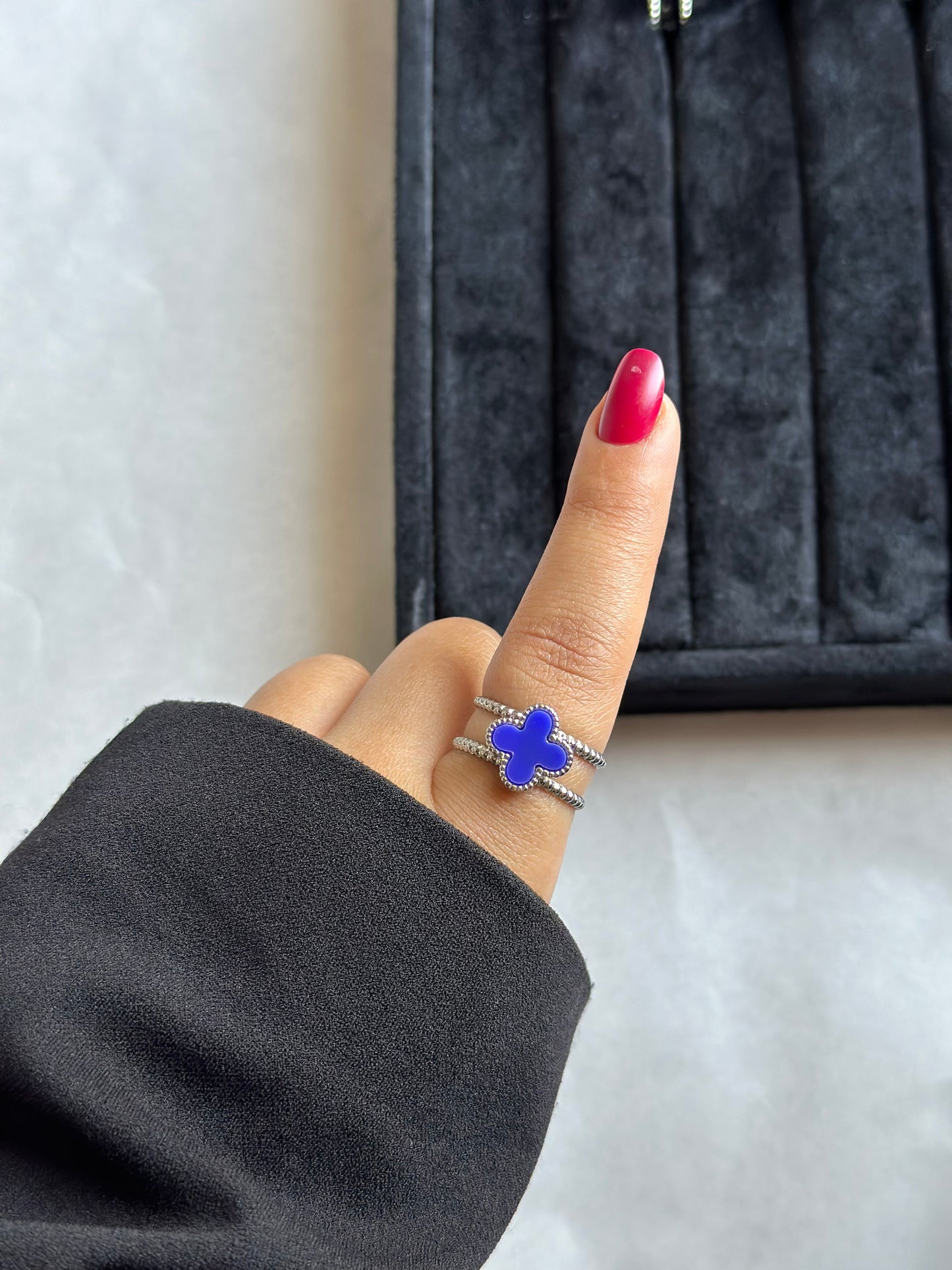 Silver colored vancleef ring