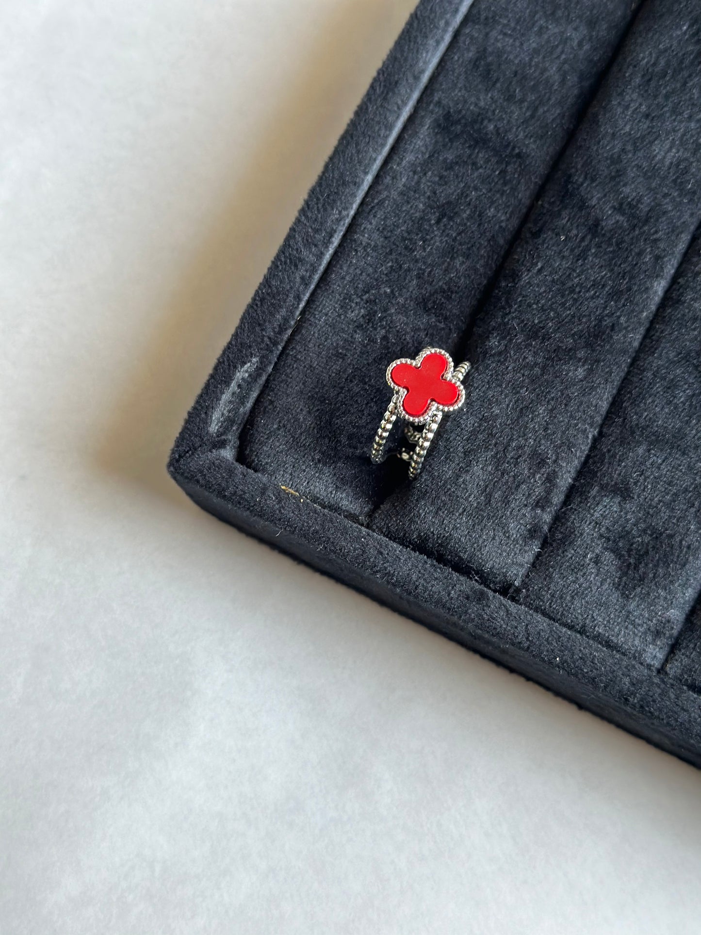 Silver colored vancleef ring